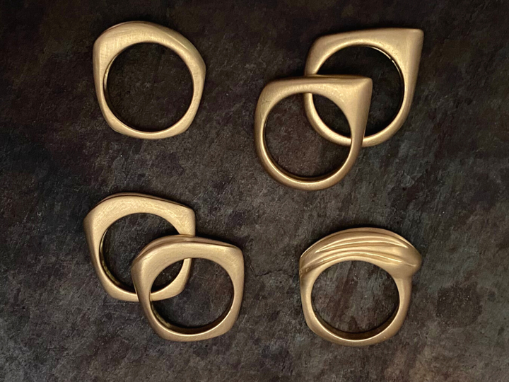 The four Honey Drip Collection Rings.