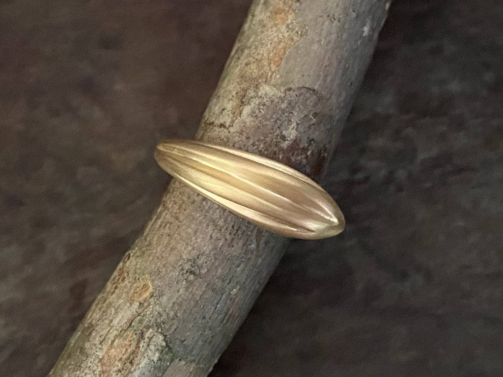 The Akasha ring from the Honey Drip Collection.