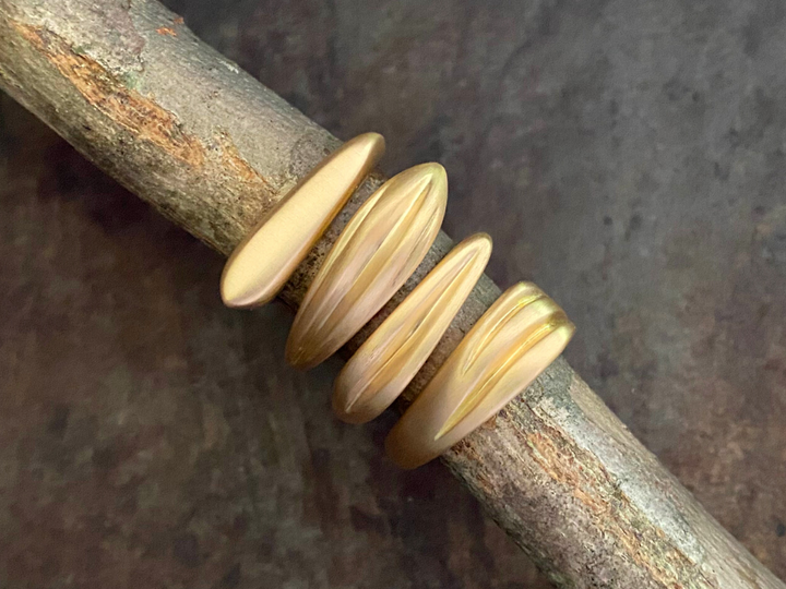 All four Honey Drip Collection Rings stacked together. 