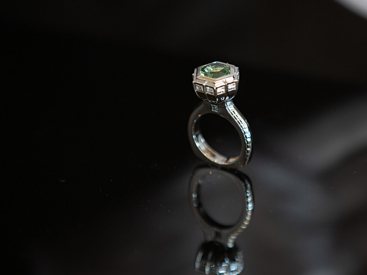 The Silo Ring, a nostalgic structure in 18K Palladium White Gold with hand cut blue/green Tourmaline.