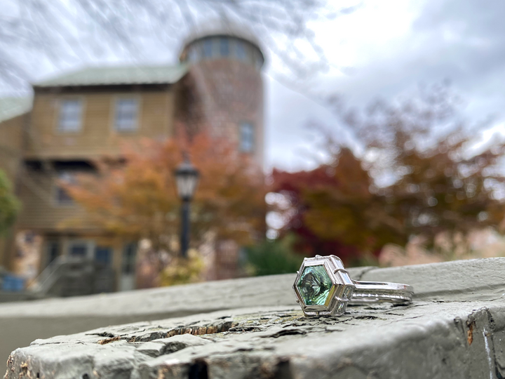The Silo Ring, a nostalgic structure in 18K Palladium White Gold with hand cut blue/green Tourmaline.
